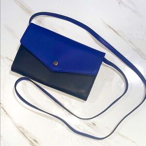 Sleek Blue and‎ Black Crossbody Bag with Minimalist Design